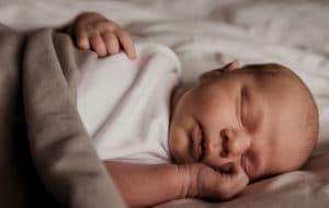 Newborn Ari Fox Sleeping Newborn Bed Grey Sheet Photography Cardiff